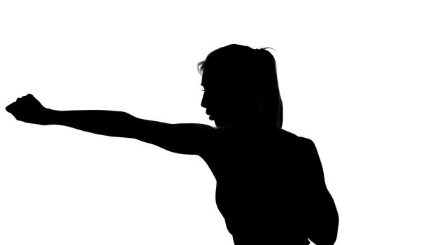 on a white background, a shadow, a black outline of a female figure doing boxing movements, a fight with a shadow, kickboxing, imitations of blows, combat techniques,. High quality photo