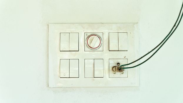 Dust shield with sockets and switches on the street on a white wall, electric. High quality photo