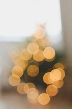 christmas background with christmas tree out of focus. abstract christmas background with defocused lights.