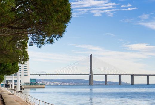 Lisbon seafront near Park of the Nations with a view of the Vasco da Gama Bridge landscape