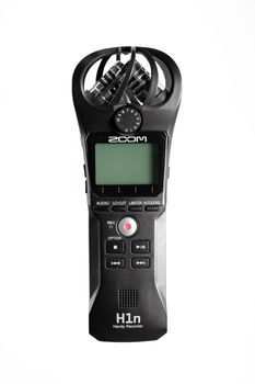 ZOOM H1n Handy recorder with microphone isolated on white background.