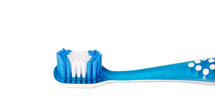 A baby blue toothbrush is isolated on a white background. toothbrush close-up. Banner. copy space. High quality photo