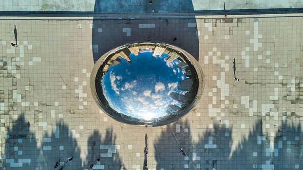 Image of Close straight down view of Chicago Cloud Gate The Bean at Millennium Park reflecting city