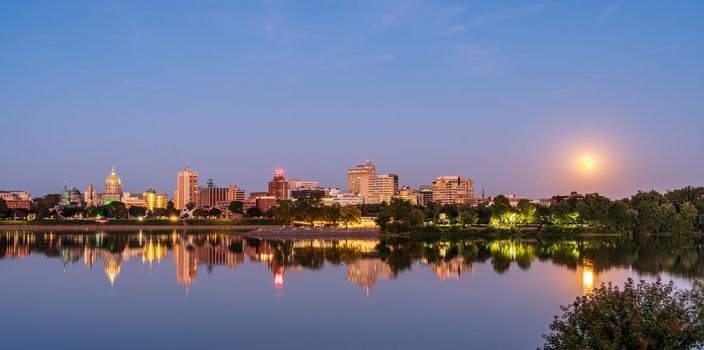 Harrisburg, PA - 9 October 2022: Panorama of the cityscape of Harrisburg in Pennsylvania with rising moon