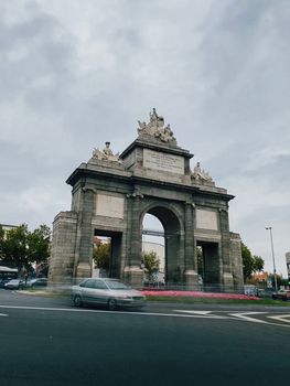Madrid, Spain, 30 October 2022. Historic Puerta de toledo roundabout with cars traffic moving around.