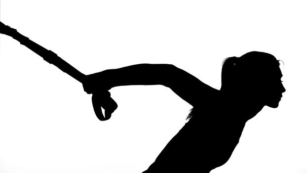 on a white background, a shadow, a black outline of a female figure doing exercises. High quality photo