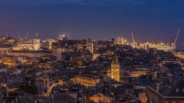 Genoa, Italy - 09 19 2020: Genoa harbor from Spianata Castelletto by night.