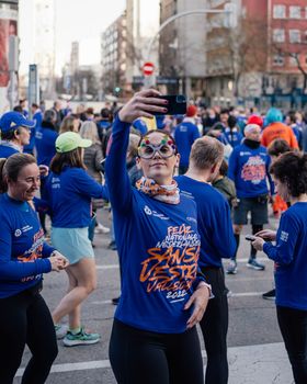 Madrid, Spain, 12 31 2022: Famous race end of year San Silvestre Vallecana. Runners preparing vertical view