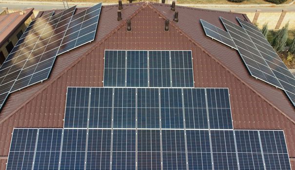 panels on a building. Solar Roof Stock. Solar panels on the roof of a house