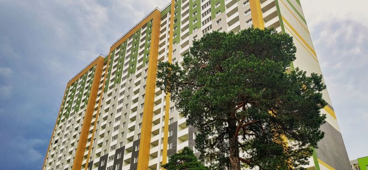 modern new apartment building on blue sky background