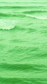 Real photo sea water waves, abstract background, nature power, bright green more tone in stock.