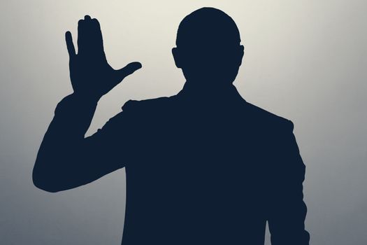 Silhouette of man waving hand in hello gesture. Anonym club concept. You are welcome.