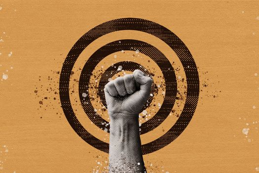 Collage fist protest against the background of the target. The concept of the revolution of the struggle for rights, solidarity and justice. High quality photo