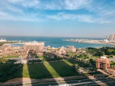 High angle view of Abu Dhabi palace , seascape and business area towers shadows.