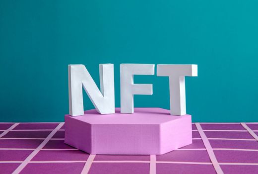 NFT on the podium as a minimum concept of a blockchain token for online business and investment and virtual transactions. High quality photo