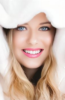 Beautiful woman in white fur coat, beauty and winter fashion.