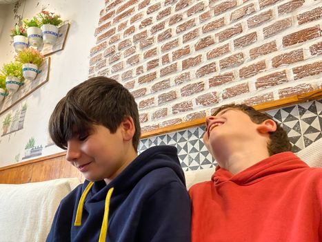 Boys laughing and enjoying together in a vintage background.