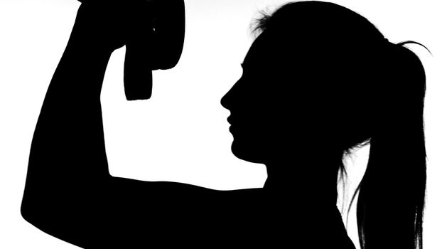 on a white background, a shadow, a black outline of a female figure doing exercises. High quality photo
