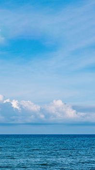 BANNER, VERTICAL STORY Atmosphere panorama white cloud clear blue sky horizon line calm empty sea. Concept paradise life. Design relax wallpaper background. More tone format in stock.