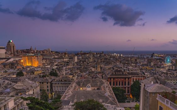 Genoa old city at sunset from Spianata Castelletto in Italy.