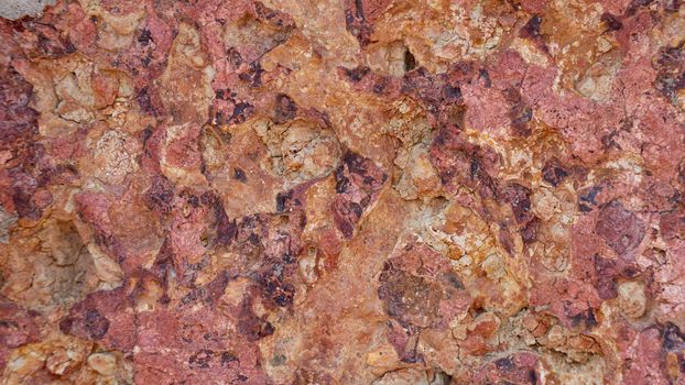 The texture of the stone is red orange, brick, background material. High quality photo