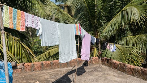 Laundry to dry on the roof under the sun on a rope, lack of technology. High quality photo