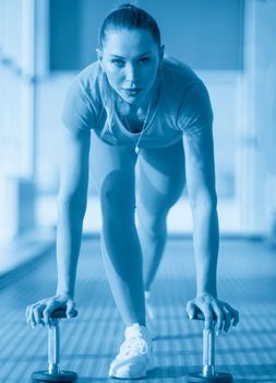 fitness woman working out with dumbbell