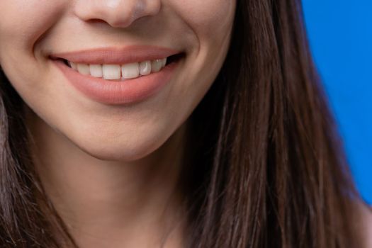 Close-up smiling mouth of woman. Perfect white healthy teeth. Emotional fun and joy lifestyle. Dental care, lips background, stomatology concept. High quality photo