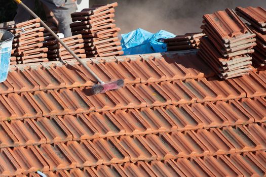 repairing the roof of a home