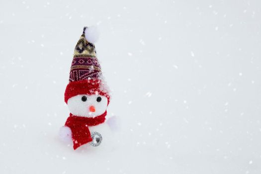 Christmas tree toy snowman on a winter background. Copy space.