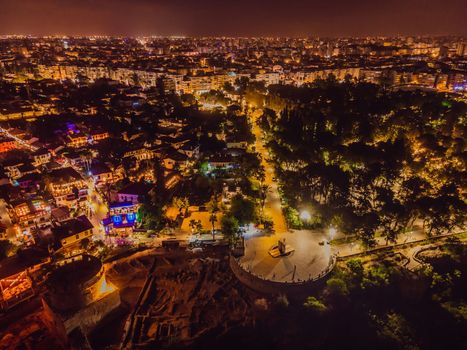 Night top aerial view of the old town Kaleici and old harbor in Antalya, Turkey. Turkey is a popular tourist destination.