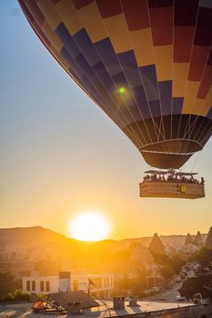 Colorful hot air balloon flying over Cappadocia, Turkey.