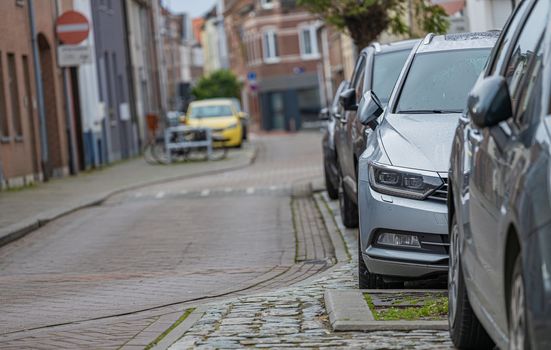 City parking. Rows of cars parked on the roadside in Tervuren, Belgium - November 20 2022