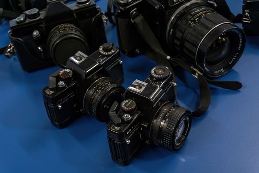 Some iconic old black cameras close up