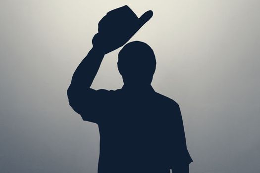 Silhouette of man waving his hat saying hello or welcome. Anonym club concept. You are welcome.