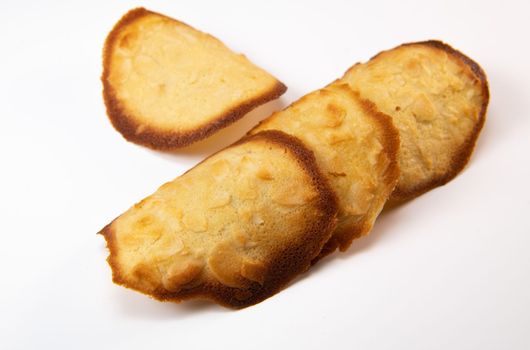 French delicacy pastry tuile with almond on wight background, High quality photo