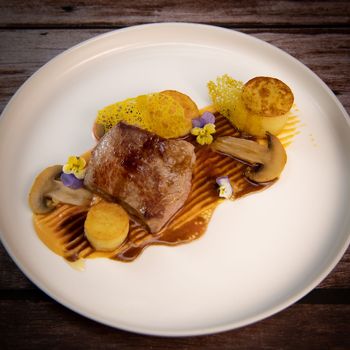 Recipe for veal, potato confit, mushroom, carrot puree, balsamic vinegar sauce, honey and veal stock. High quality photo