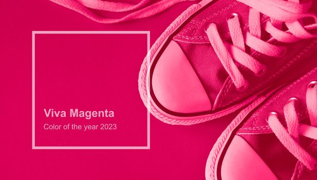 Viva Magenta monochrome sneakers. Trendy color 2023 concept. High quality photo
