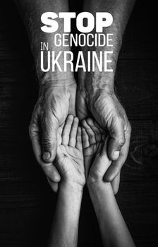 male hands hold childrens on a dark background with words stop genocide in ukraine black and white color. concept needs help and support, truth will win