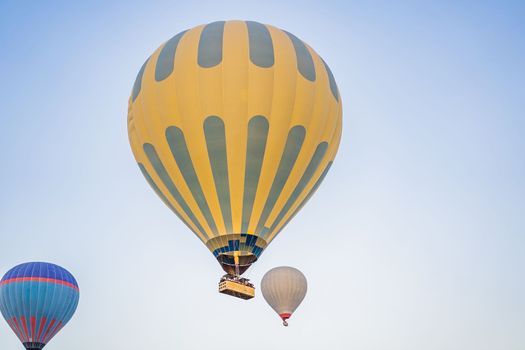 Beautiful hot air balloons over blue sky.