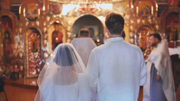 Newlyweds at a church russian wedding ceremony