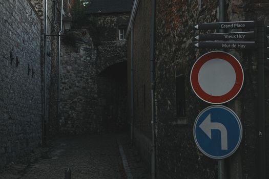 Road sign in old Medieval European town Huy. Belgium October 08 2022