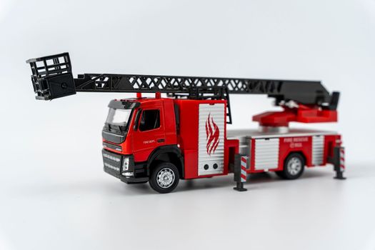 toy fire truck on a white background. Emergency vehicle. Close-Up Of Toy fire truck Against White Background. High quality photo