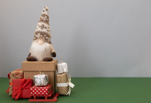 christmas gnome gonk on the craft wrapped gifts. High quality photo