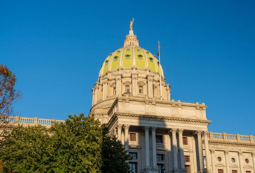 Detail of the dome of the Pennsylvania State Capitol building in Harrisburg PA as the sun sets