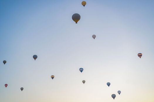 Beautiful hot air balloons over blue sky.