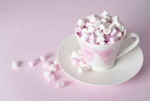 light pink and white marshmallows in a beautiful ceramic cups with pink hearts, Concept Mother's Day gift, Valentine's Day. High quality photo