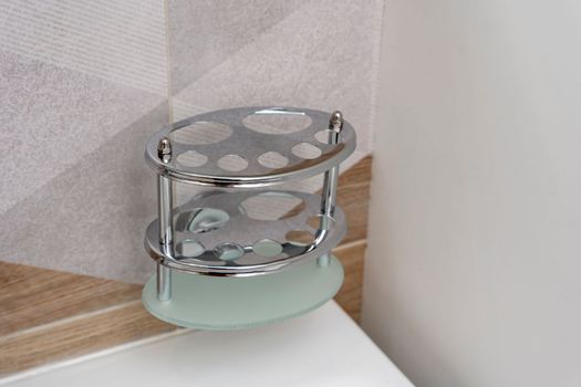 a special shiny toothbrush holder in the bathroom interior. renovation in the bathroom. bathroom accessories.