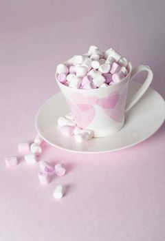 light pink and white marshmallows in a beautiful ceramic cups with pink hearts, Concept Mother's Day gift, Valentine's Day. High quality photo