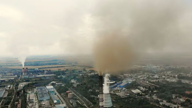 CHERKASY, UKRAINE, SEPTEMBER 12, 2018: Big Power plant , factory with pipes, expelling smoke into sky. Smoke from industrial chimney. ecology, pollution of the environment. High quality photo